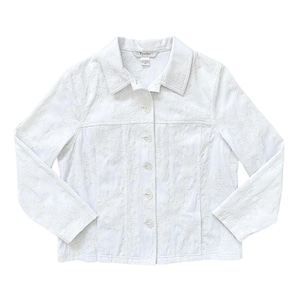 May include: White, button-down jacket with floral embroidery. The jacket has long sleeves, a collar, and a button closure. The brand name "Tandler" is visible on the label. A classic, lightweight outerwear piece.