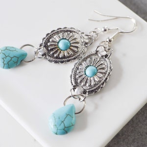 Dangling earrings with concho pattern charms and howlite turquoise drop, ethnic bohemian jewelry for women, ideal as a gift image 2