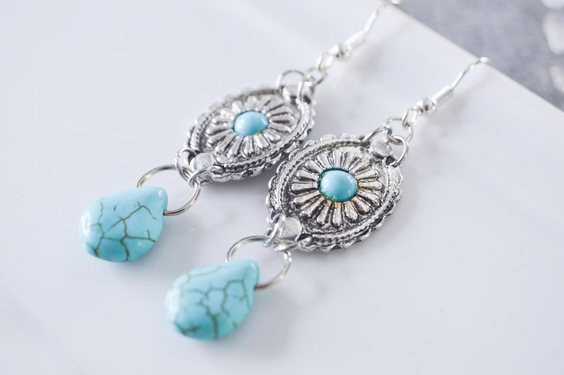 Dangling earrings with concho pattern charms and howlite turquoise drop, ethnic bohemian jewelry for women, ideal as a gift image 1