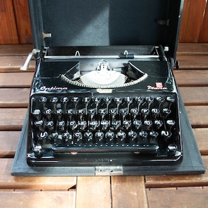 Vintage Optima Plana black  portable German typewriter