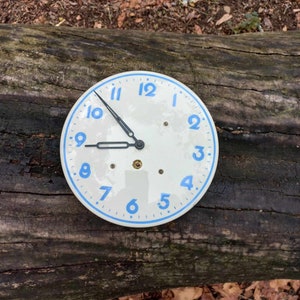 Vintage German porcelain mechanical wall clock