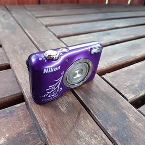 Nikon Coolpix L31 Japanese digital camera in purple color