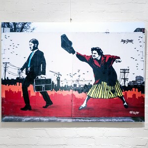 May include: A street art mural depicting two figures. A man in a suit walks to the right, carrying a briefcase. A woman in a red jacket and yellow skirt throws a shoe to the left. The mural is painted on a white wall with red, orange, and yellow accents. The text "Hop Louie" is visible in the upper right corner.