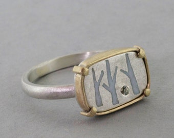 Birch silver and gold tree ring with enamel and green sapphire, woodland inspired handmade jewellery.