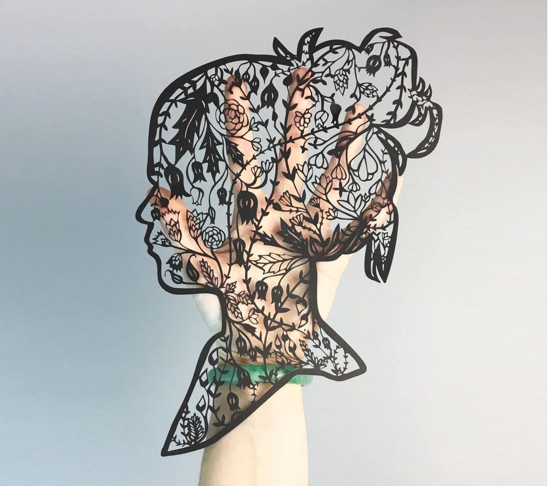 自転車とパズルピースのアート作品 切り絵