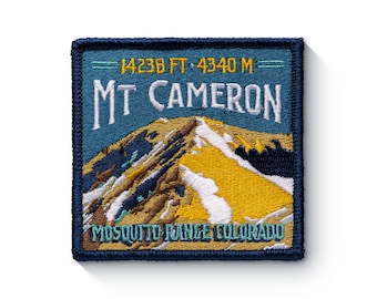 May include: A blue and yellow embroidered patch with the text "Mt Cameron" and "Mosquito Range, Colorado". The patch also includes the elevation of the mountain, "14238 FT - 4340 M".