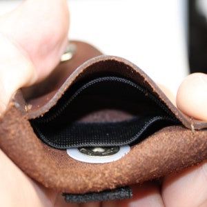 Pet tag silencer custom leather pouch for dog collars and Martindale collars. This is a hand dyed and hand stamped product, handcrafted with 3oz. vegetable-tanned leather.