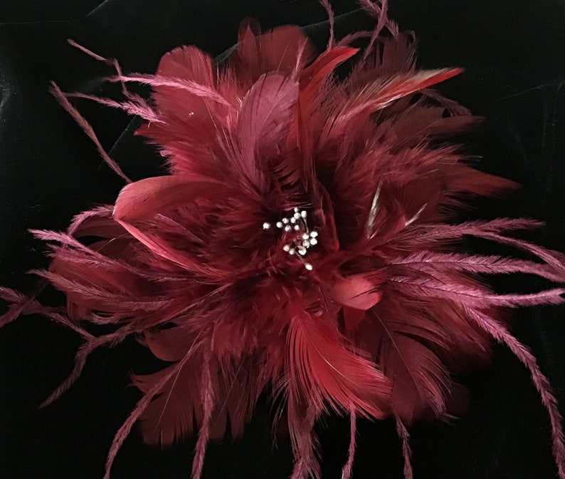 Dark red wine shades. Feather Fascinator Hair Clip, Fashion Pin Fashion Accessory. Made in USA image 1