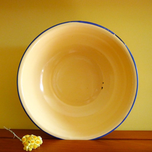 Vintage enamel cream and blue bowl. Retro kitchen