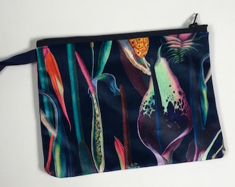 Velvet new tropical plants  Coin purse or make-up bag on navy background.