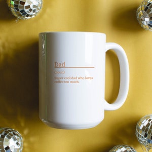 15oz white mug with a customizable definition design in orange. Add a name and the definition for that person.