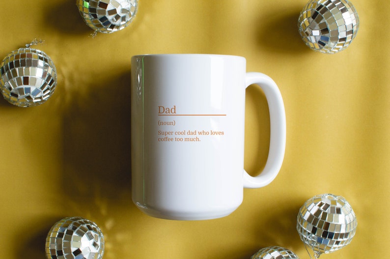 15oz white mug with a customizable definition design in orange. Add a name and the definition for that person.