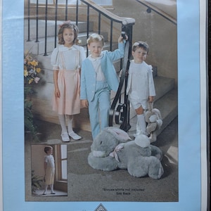 May include: A pattern package titled "Eton Ensemble" featuring children's clothing. The image shows three children in coordinated outfits, including a light blue suit, a pink dress, and white shirts. A large stuffed bunny is in the foreground. Sizes 2-7.