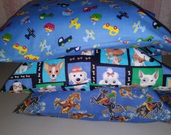 3 Travel or Toddler size pillowcases. Cowboys and horses, cute dogs, airplanes, boats, and pickup trucks. Handmade