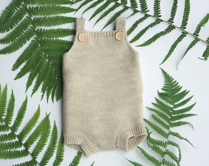Knitted baby romper in wool alpaca blend, available in many colors