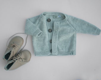 Warm and soft hand knitted baby cardigan for baby girl or baby boy available in many colors