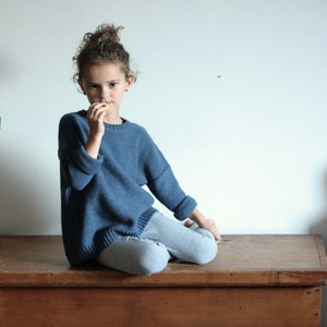 Oversized knitted jumper for kids or toddlers, long, soft and warm.