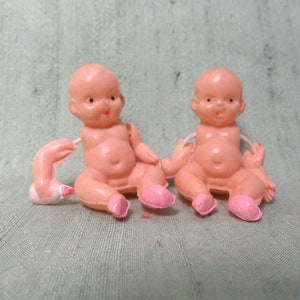 Two celluloid 1.25&quot; sitting babies with bottles / vintage tiny baby doll, penny doll,  moveable arms, made in Japan
