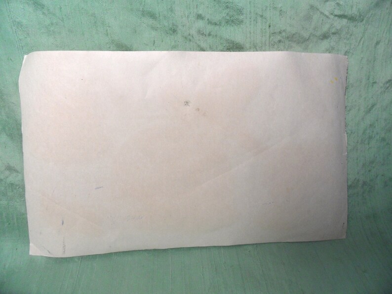 May include: A blank white sheet of paper with a few faint marks on it.