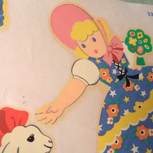 May include: A vintage illustration of a girl wearing a pink hat and a blue dress with white stars and yellow flowers. She is holding a bunch of green flowers and reaching out to a white lamb with a red bow.
