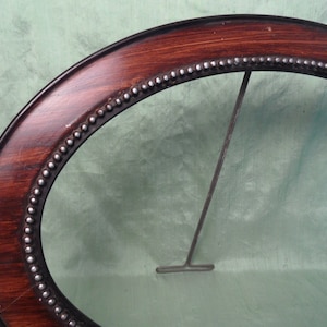 Oval carved wood picture frame w stand / brown and black vintage empty frame