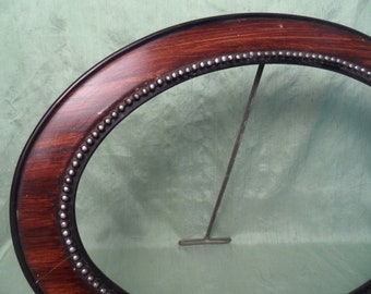 Oval carved wood picture frame w stand / brown and black vintage empty frame