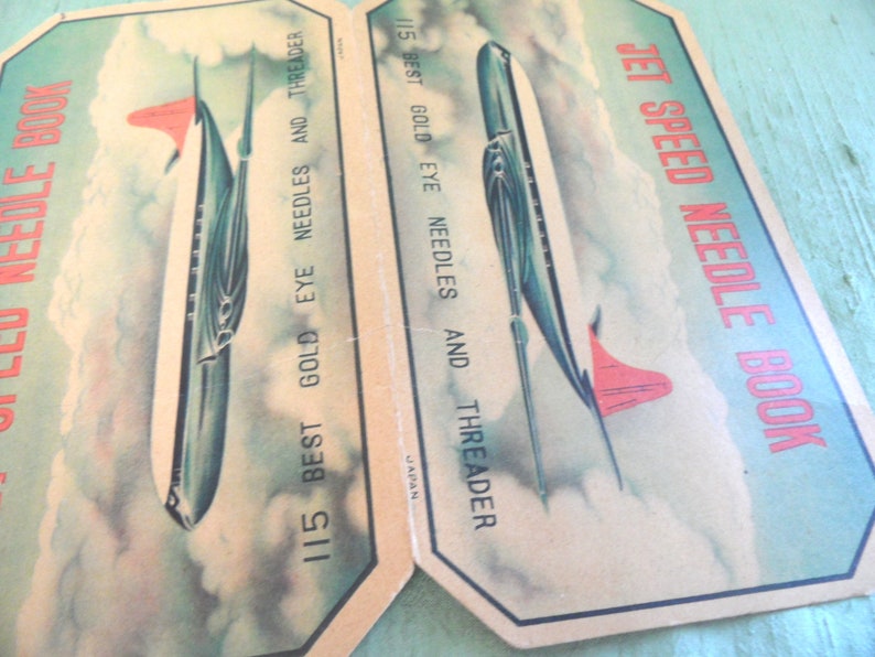 May include: Vintage Jet Speed Needle Book with a retro illustration of a jet plane on the cover. The book contains 115 best gold eye needles and a threader. Made in Japan.