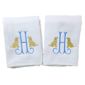 Boy burp cloth monogrammed with a single initial surrounded on either side with embroidered yellow lab dogs.