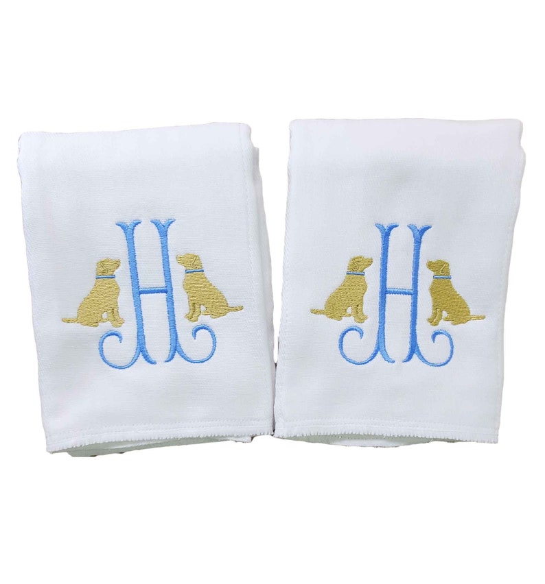 Boy burp cloth monogrammed with a single initial surrounded on either side with embroidered yellow lab dogs.