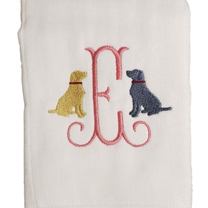 Cotton diaper burp cloth embroidered with a single initials framed with two dogs. Colors can be customized for a baby boy or girl.