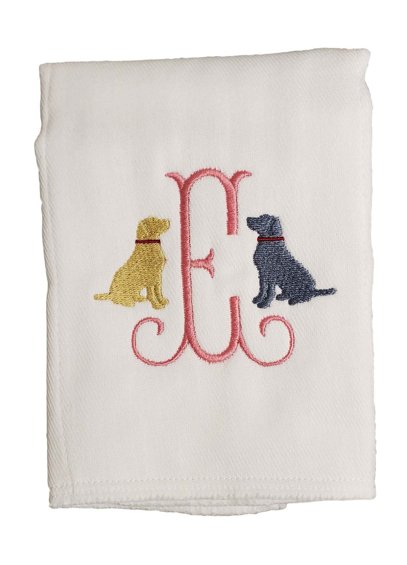 Cotton diaper burp cloth embroidered with a single initials framed with two dogs. Colors can be customized for a baby boy or girl.