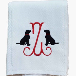 Cotton diaper burp cloth embroidered with a single initials framed with two dogs. Colors can be customized for a baby boy or girl. Red thread color initial and dog collars.