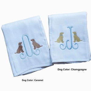 Cotton diaper burp cloth embroidered with a single initials framed with two dogs. Colors can be customized for a baby boy or girl.