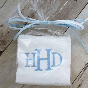 Gift wrapped baby boy monogrammed burp cloth.