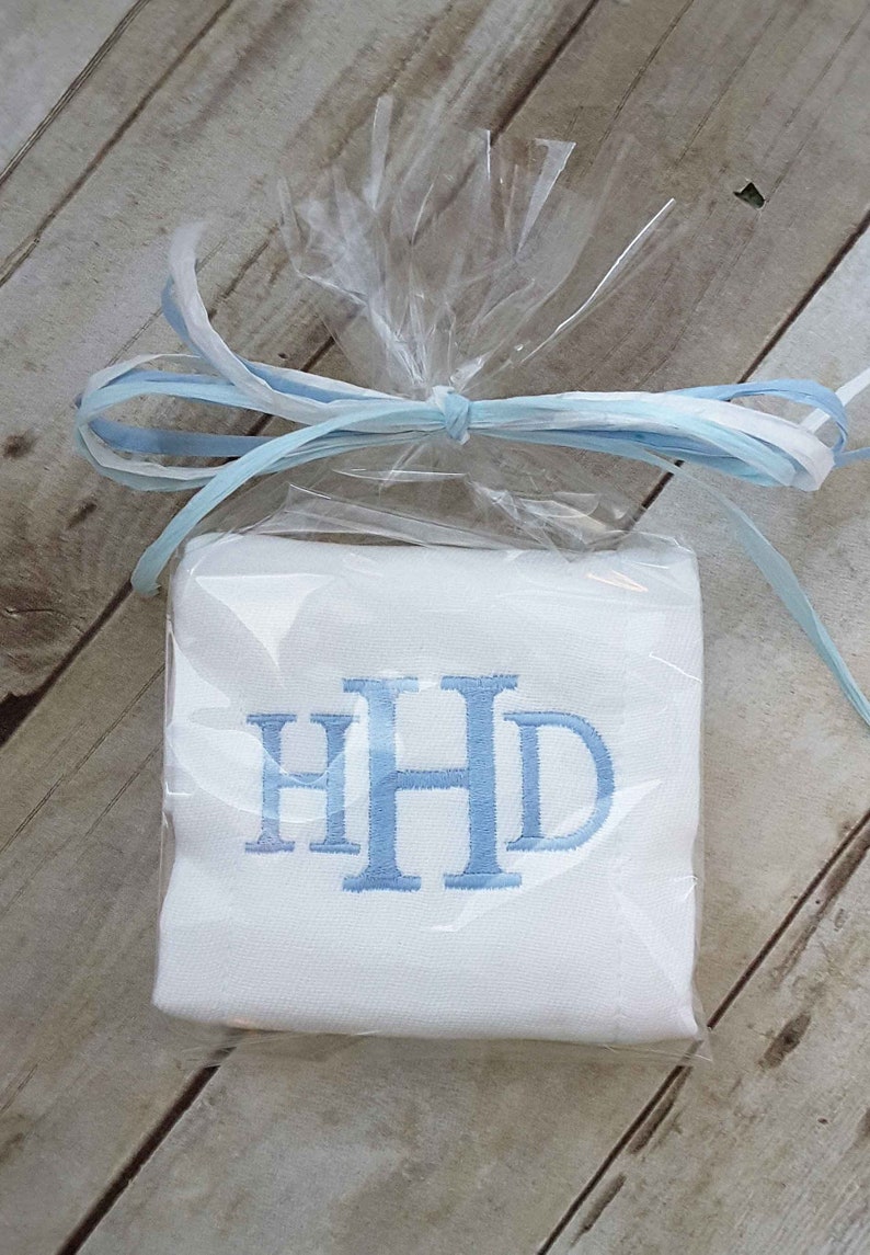 Gift wrapped baby boy monogrammed burp cloth.