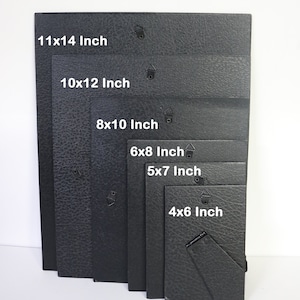 May include: Set of eight black picture frames in various sizes, including 11x14 inch, 10x12 inch, 8x10 inch, 6x8 inch, 5x7 inch, and 4x6 inch.