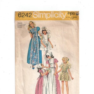 May include: Simplicity sewing pattern number 6242 for a child's dress. The pattern includes four different styles of dresses, all with a white background and colorful accents. The dresses are shown on four different models, all with long hair and wearing white tights.