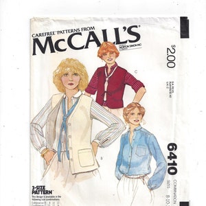 May include: McCall's sewing pattern number 6410, a combination pattern for sizes 8-10-12. The pattern features two women's tops, one with a vest and the other a button-down shirt. The pattern is available in a variety of size combinations.