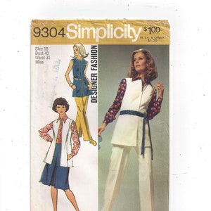 May include: A vintage sewing pattern for a women's pantsuit. The pattern is from Simplicity and is number 9304. The pattern is for a size 18, bust 40, waist 31. The pattern shows two different styles of pantsuits, one with a vest and one with a jacket.