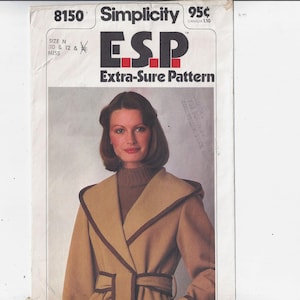 May include: Simplicity sewing pattern number 8150 for a brown coat with a large collar and a belt. The pattern is for sizes 10, 12, and 14. The pattern is labeled "ESP Extra-Sure Pattern" and costs 95 cents.