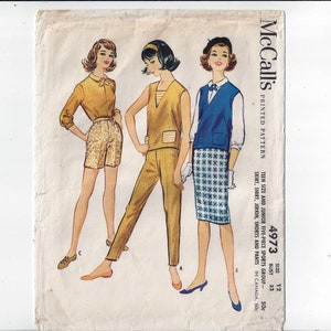 May include: A vintage sewing pattern for a five-piece sports outfit. The pattern includes a skirt, shirt, jerkin, shorts, and pants. The pattern is for teen and junior sizes and is printed on paper.