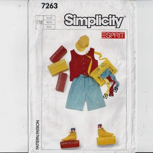 May include: Simplicity pattern 7263 for a boy's outfit. The outfit includes a red sleeveless vest, blue shorts, a yellow belt, a blue and yellow striped hat, and a pair of blue and white striped shoes. The pattern is labeled "Esprit".