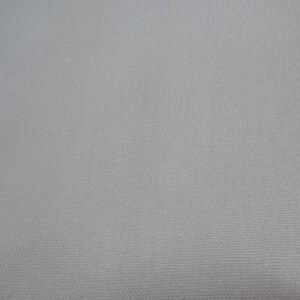 May include: A plain white fabric with a subtle woven texture.