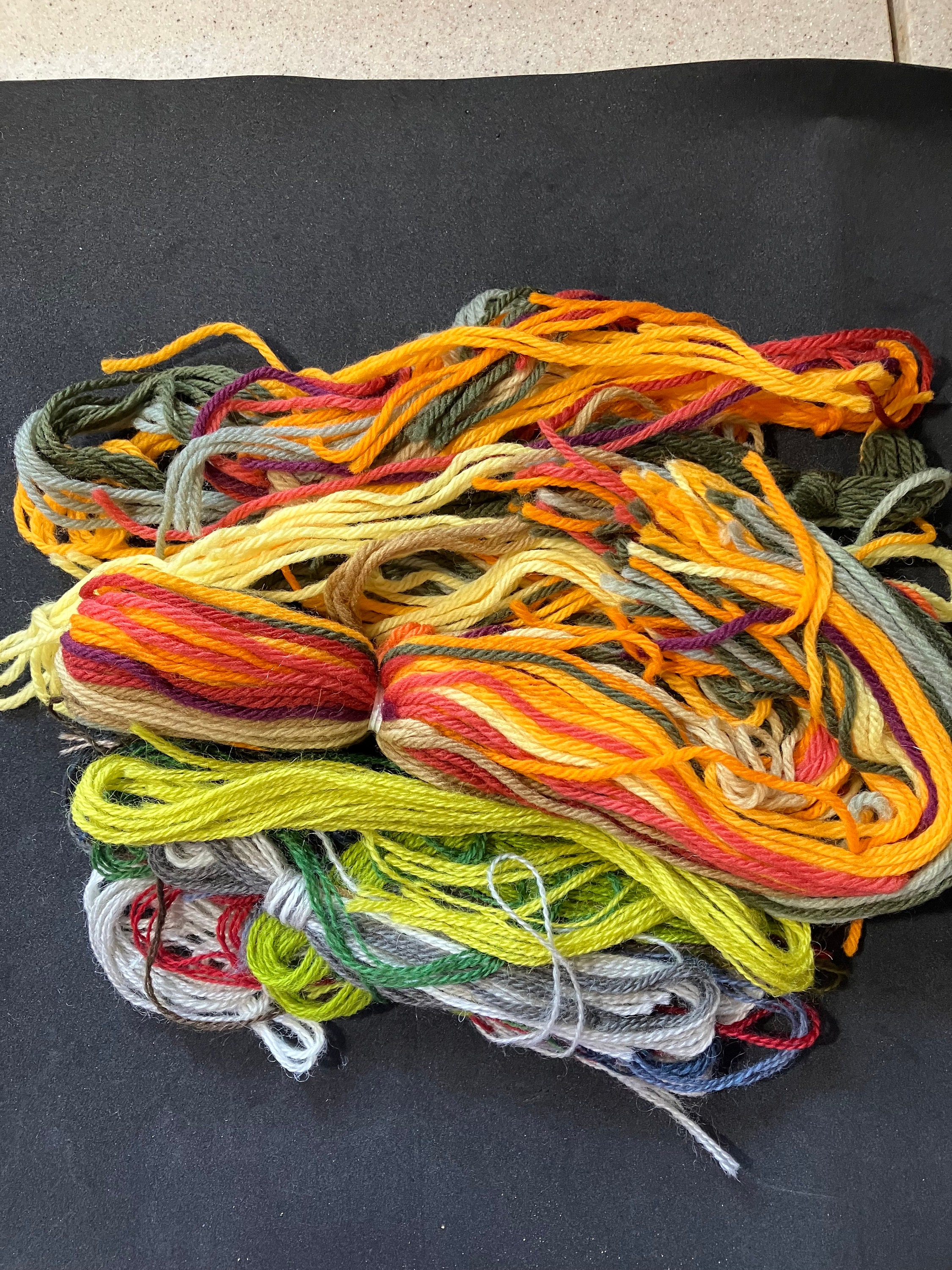 Many colorful yarn for handmade knitting in a needlework shop. Stock Photo  by Glebcallfives