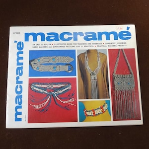 May include: A vintage macramé book with the title "macramé" in large blue letters. The cover features examples of macramé projects, including belts, necklaces, and a bag. The book is an illustrated guide for teachers and hobbyists.