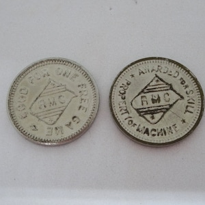 Two RMC Gaming Tokens, Good for One Free Game, Awarded for Skill, 3/4 Inches Diameter, Silver Tone, Gaming Arcade Souvenir