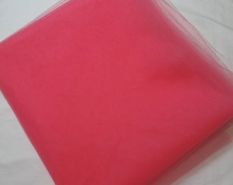 May include: A bright pink tulle fabric, perfect for crafting and DIY projects.