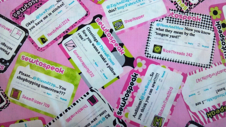 May include: A pink fabric background with several colorful fabric scraps featuring the text "sewtospeak" and various sewing-related phrases. The scraps are decorated with black and white polka dots, green and white stripes, and black and white checkered patterns.