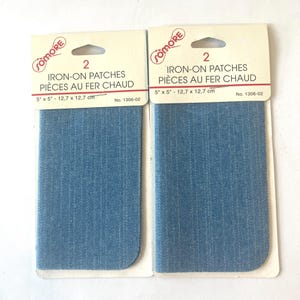 May include: Two packages of Somore iron-on patches, each containing two rectangular blue denim fabric pieces measuring 5 inches by 5 inches. The packaging features the brand name, the text 2 IRON-ON PATCHES, and the product number 1306-02.