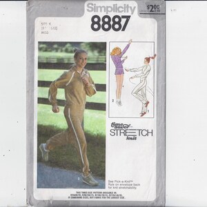 May include: Simplicity 8887 sewing pattern for a Misses' tracksuit. The pattern features a woman wearing a tan tracksuit with white stripes. The pattern also includes illustrations of other tracksuit designs. The text "time saver" and "STRETCH knit" are visible.